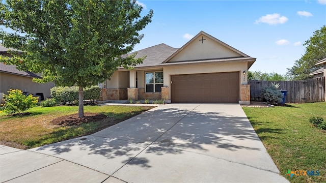 view of front of home featuring a garage and a front yard