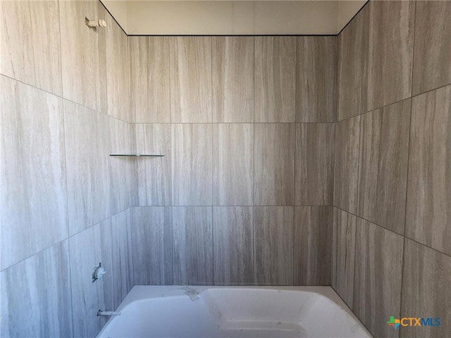 bathroom featuring  shower combination