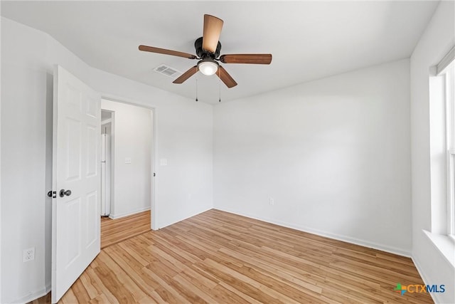 unfurnished room with light wood-style flooring and a ceiling fan