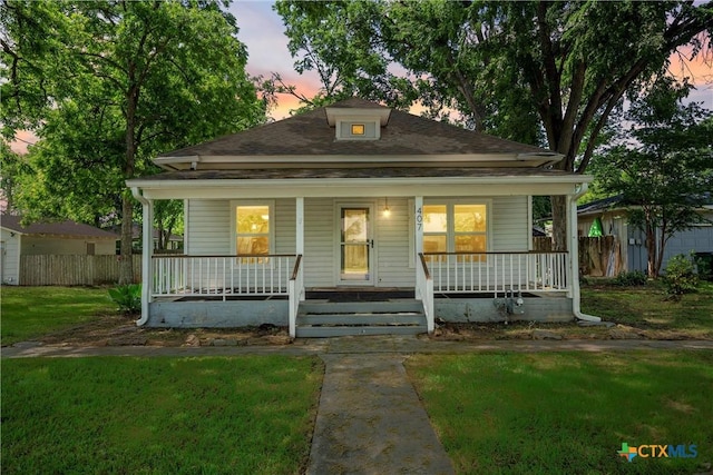bungalow-style house featuring a porch and a shingled roof