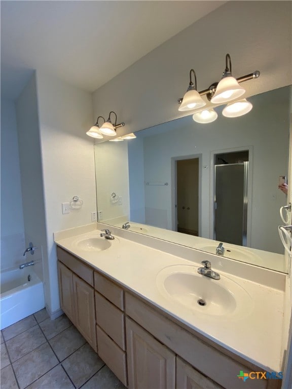 bathroom with tile patterned floors, vanity, and independent shower and bath