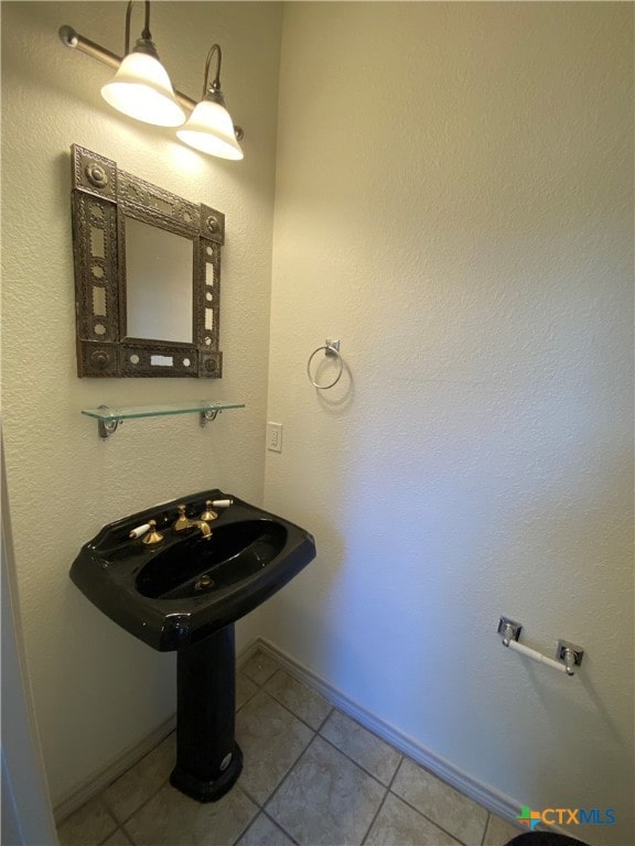 bathroom with tile patterned flooring