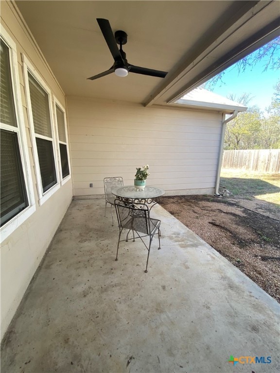 view of patio featuring ceiling fan