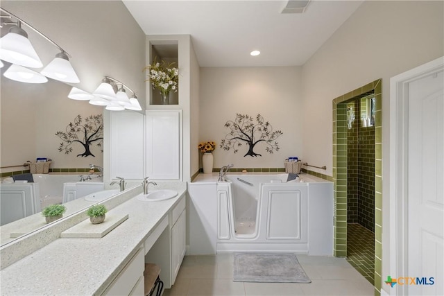 full bathroom with vanity, tile patterned floors, visible vents, tiled shower, and a garden tub