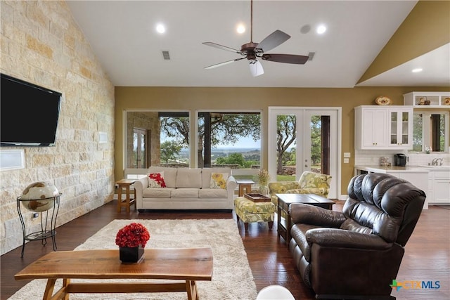 living room with ceiling fan, high vaulted ceiling, french doors, recessed lighting, and dark wood-style floors