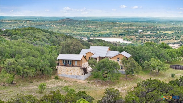 aerial view featuring a wooded view