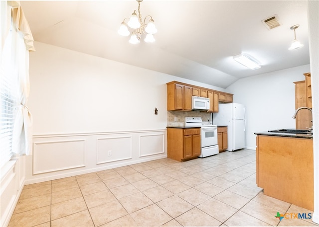 kitchen with tasteful backsplash, pendant lighting, white appliances, and a notable chandelier