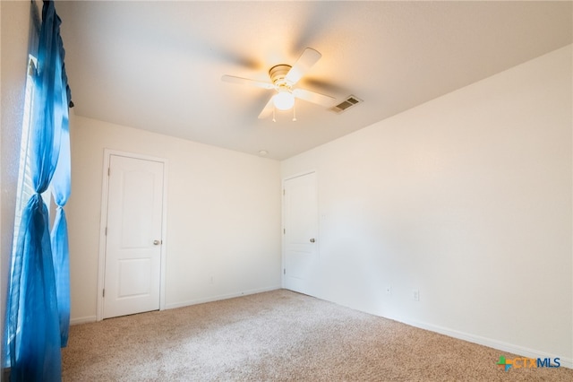 empty room with carpet flooring and ceiling fan