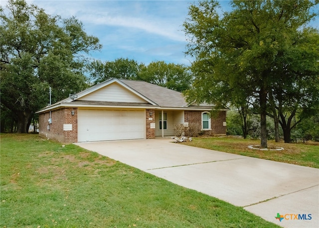 ranch-style home with a garage and a front lawn