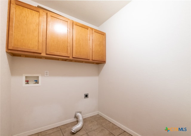 laundry room with hookup for an electric dryer, hookup for a washing machine, cabinets, and light tile patterned floors