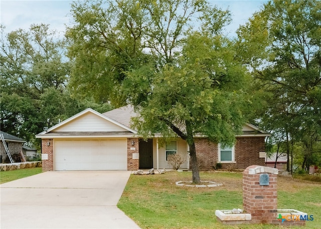 view of front of property featuring a garage and a front yard