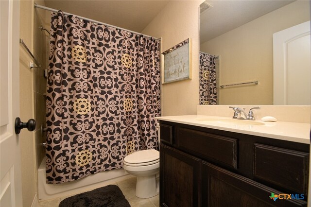 full bathroom with tile patterned floors, vanity, shower / bath combination with curtain, and toilet