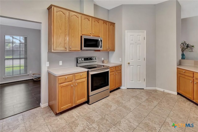 722 Ashland Crk, Victoria, TX 77901 - kitchen featuring stainless steel electric stove and light countertops