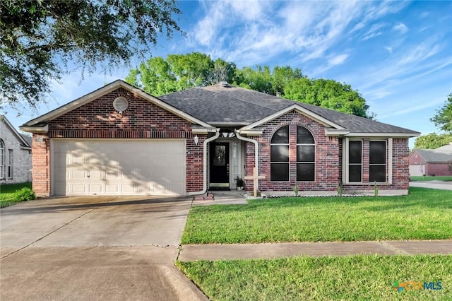 722 Ashland Crk, Victoria, TX 77901 - single story home with brick siding, a garage, a shingled roof, and concrete driveway