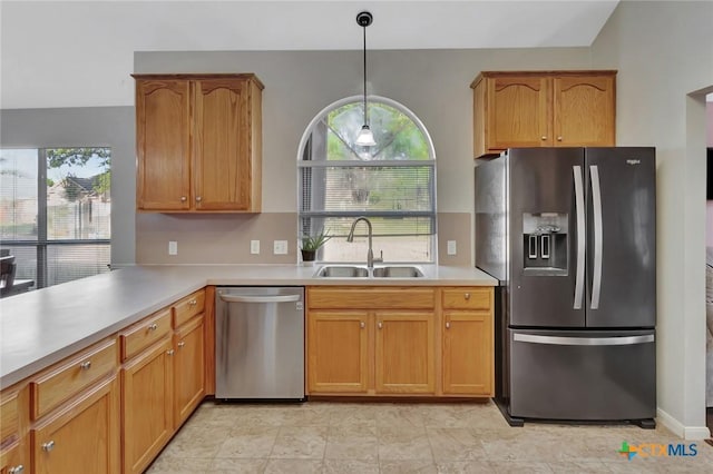 722 Ashland Crk, Victoria, TX 77901 - kitchen with appliances with stainless steel finishes, healthy amount of natural light, light countertops, and pendant lighting