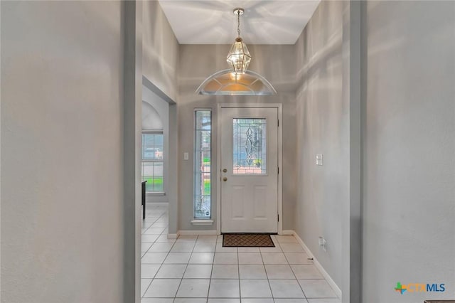 722 Ashland Crk, Victoria, TX 77901 - foyer entrance with light tile patterned floors and a chandelier
