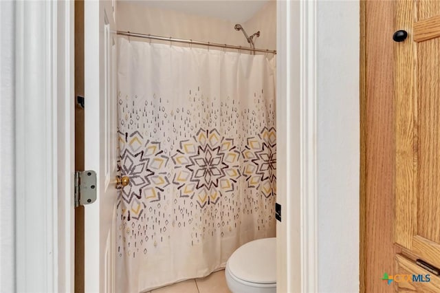 722 Ashland Crk, Victoria, TX 77901 - bathroom featuring a shower with curtain and tile patterned floors