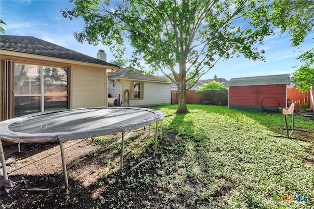 722 Ashland Crk, Victoria, TX 77901 - view of yard with a trampoline and a storage shed