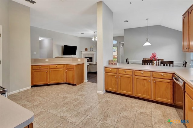 722 Ashland Crk, Victoria, TX 77901 - kitchen featuring dishwasher, ceiling fan, a peninsula, light countertops, and a tile fireplace