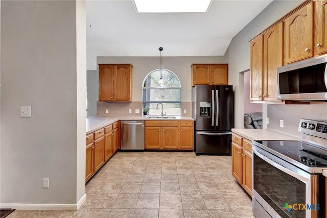 722 Ashland Crk, Victoria, TX 77901 - kitchen featuring appliances with stainless steel finishes, light countertops, and hanging light fixtures