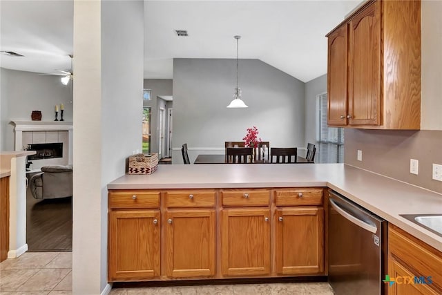 722 Ashland Crk, Victoria, TX 77901 - kitchen featuring dishwasher, a peninsula, a ceiling fan, healthy amount of natural light, and vaulted ceiling