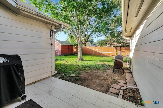 722 Ashland Crk, Victoria, TX 77901 - view of patio / terrace with a shed and grilling area