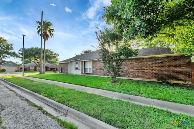 722 Ashland Crk, Victoria, TX 77901 - single story home featuring brick siding and a front lawn