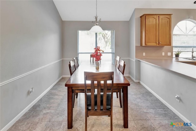 722 Ashland Crk, Victoria, TX 77901 - dining area with vaulted ceiling and baseboards