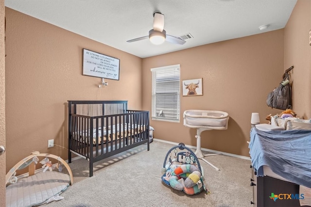 bedroom featuring ceiling fan and carpet flooring