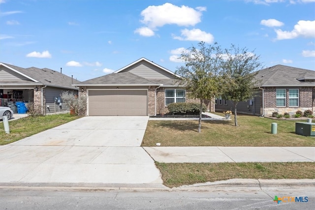 ranch-style house featuring a garage and a front lawn