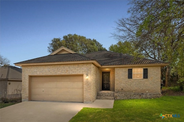 127 Dolly St, San Marcos, TX 78666 - ranch-style house featuring a front lawn, stone siding, an attached garage, and driveway