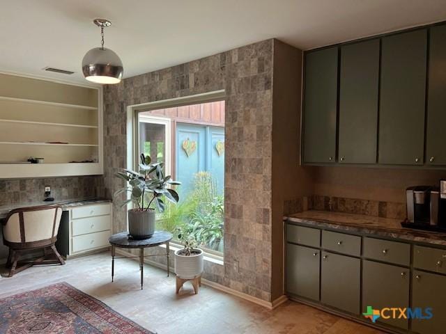 6014 Country Club Dr, Victoria, TX 77904 - interior space with pendant lighting, dark countertops, and gray cabinetry