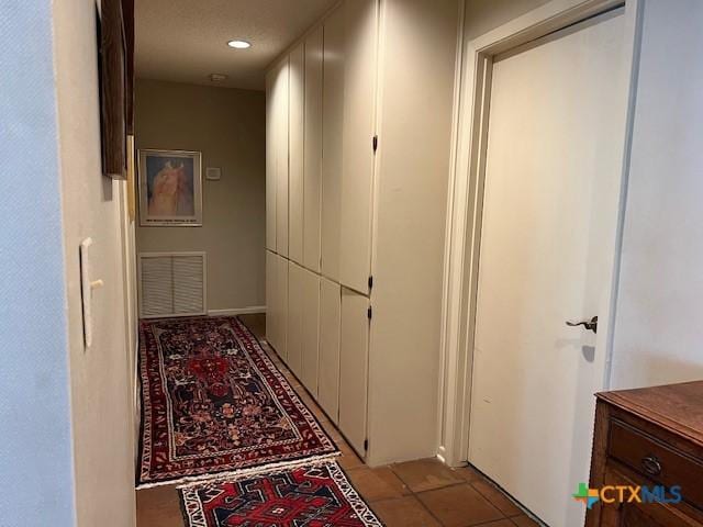 6014 Country Club Dr, Victoria, TX 77904 - hallway with visible vents, recessed lighting, and light tile patterned floors