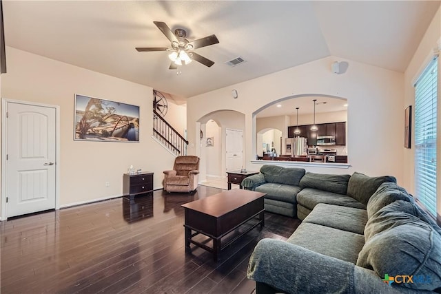 living room featuring hardwood / wood-style floors, ceiling fan, and lofted ceiling