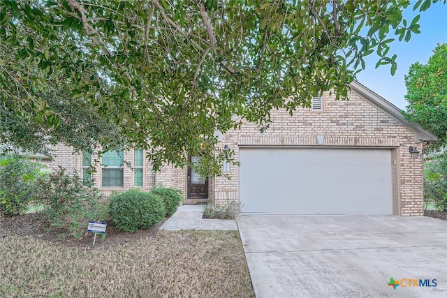 obstructed view of property featuring a garage