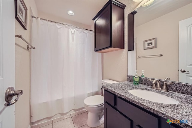 full bathroom with toilet, shower / bath combination with curtain, vanity, and tile patterned floors