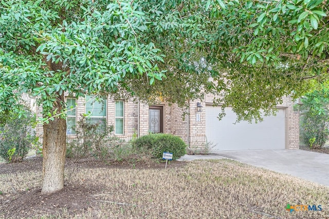 obstructed view of property featuring a garage