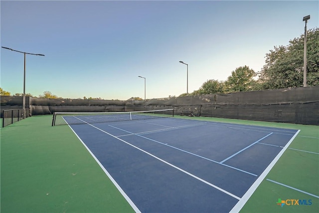 view of sport court with basketball hoop