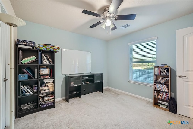 miscellaneous room featuring light carpet and ceiling fan