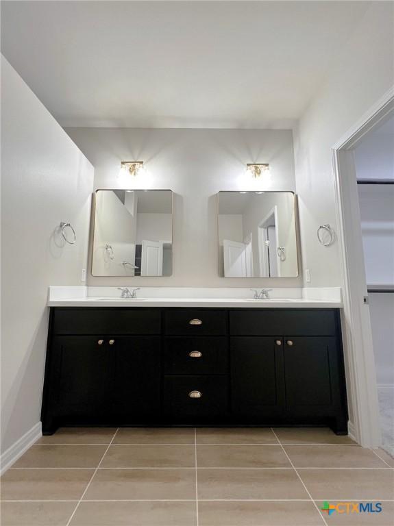 bathroom featuring tile patterned floors and vanity