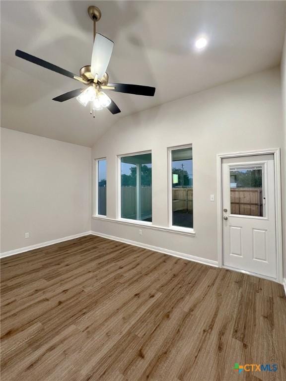 unfurnished room featuring hardwood / wood-style floors, ceiling fan, and lofted ceiling