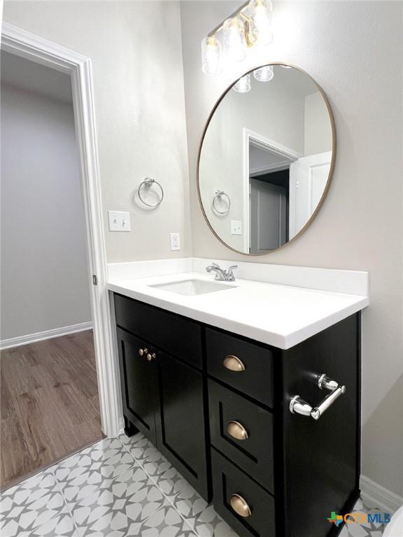 bathroom featuring hardwood / wood-style floors and vanity