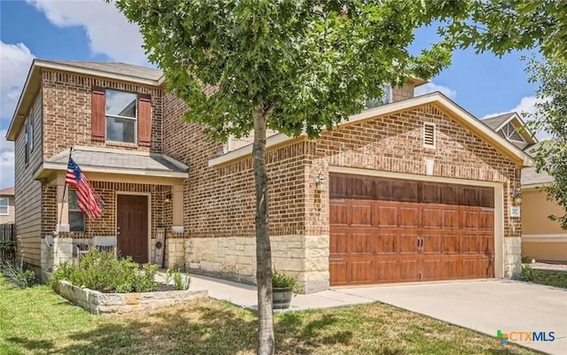 view of front facade with a garage, stone siding, concrete driveway, and brick siding