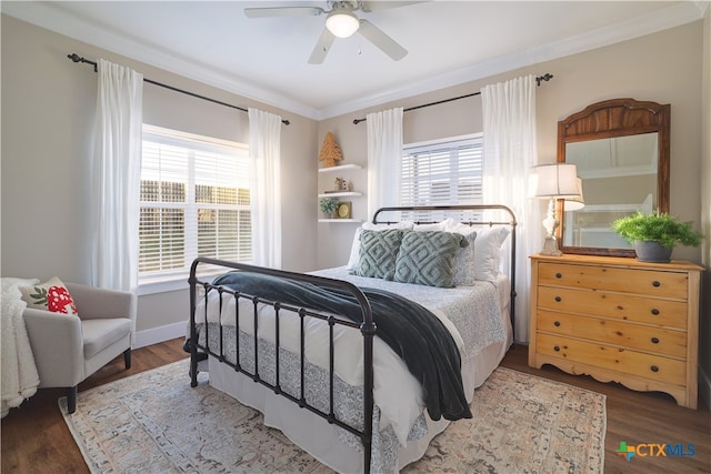 bedroom featuring hardwood / wood-style floors, ceiling fan, multiple windows, and ornamental molding