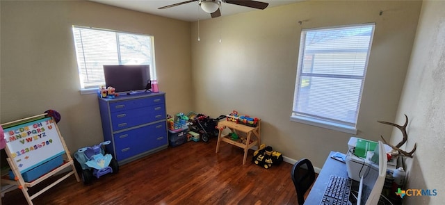 recreation room featuring dark wood-type flooring and ceiling fan