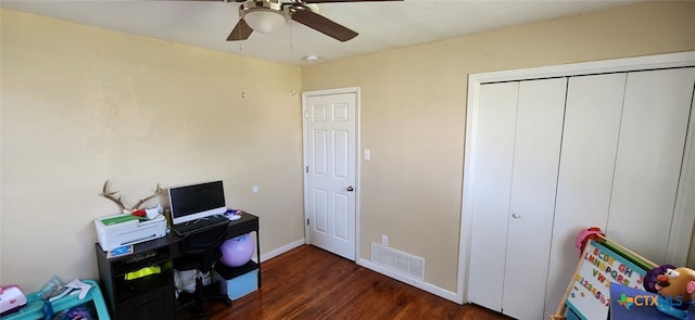 office space featuring dark hardwood / wood-style floors and ceiling fan