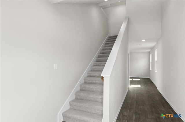 stairway featuring hardwood / wood-style floors