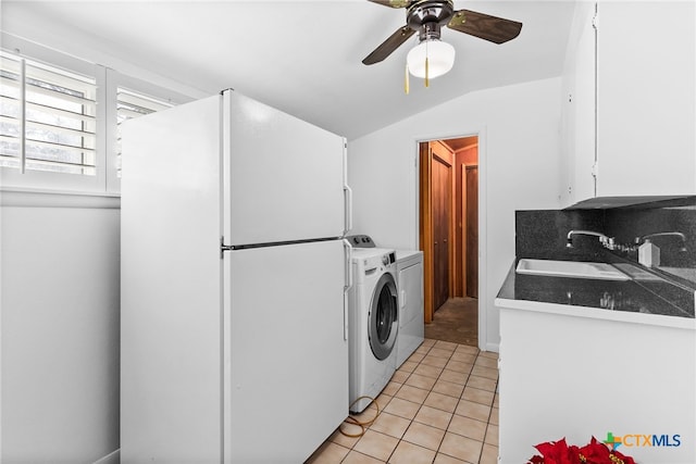 laundry room with separate washer and dryer, ceiling fan, sink, and light tile patterned floors