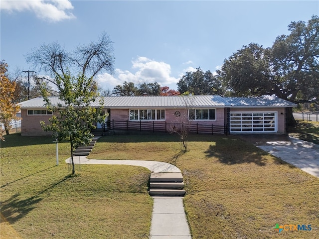 ranch-style home featuring a front yard