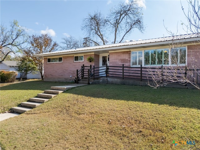 ranch-style home with a front yard